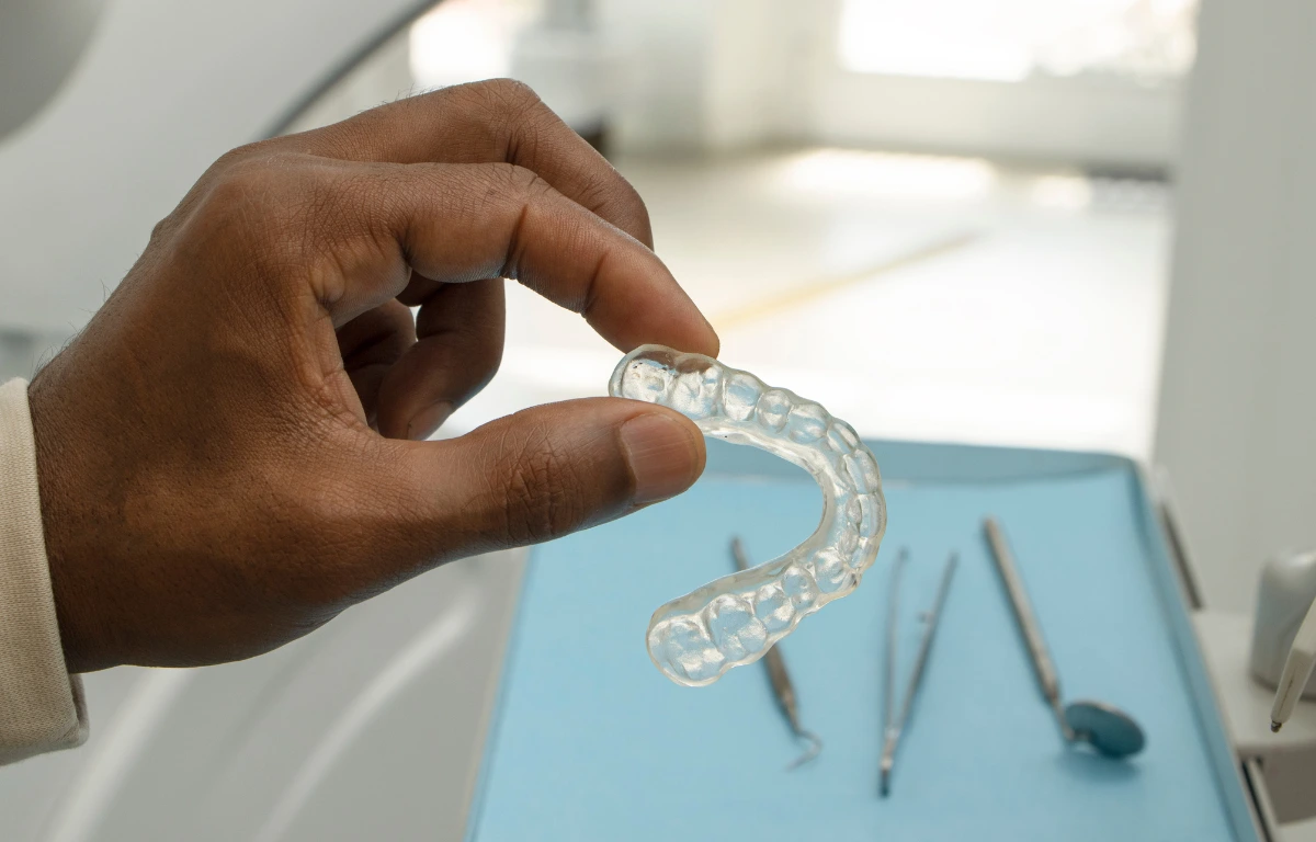 Technician designing aligners from dental impressions